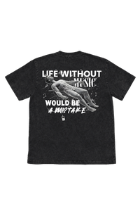 Vintage washed black streetwear t-shirt with life without music would be a mistake front graphic and artistic figure print on a minimal studio background.