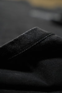 RAMM4EVER t-shirt in graphic streetwear style showcasing fabric texture and stitching detail in a close-up view.