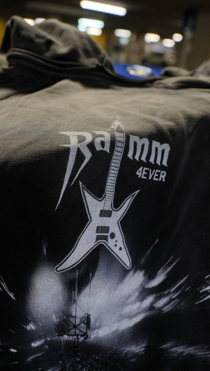 Vintage washed black streetwear hoodie with RAMM4EVER logo and electric guitar graphic print shown in a close-up detail.